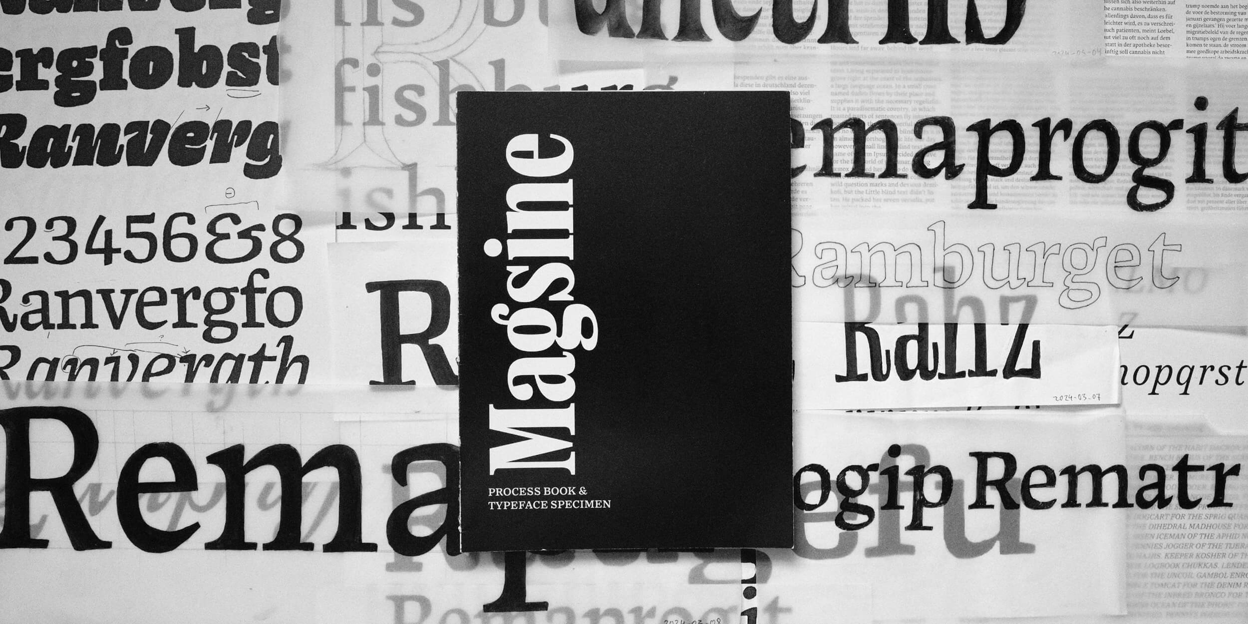 photo of the processbook on pile of sketches